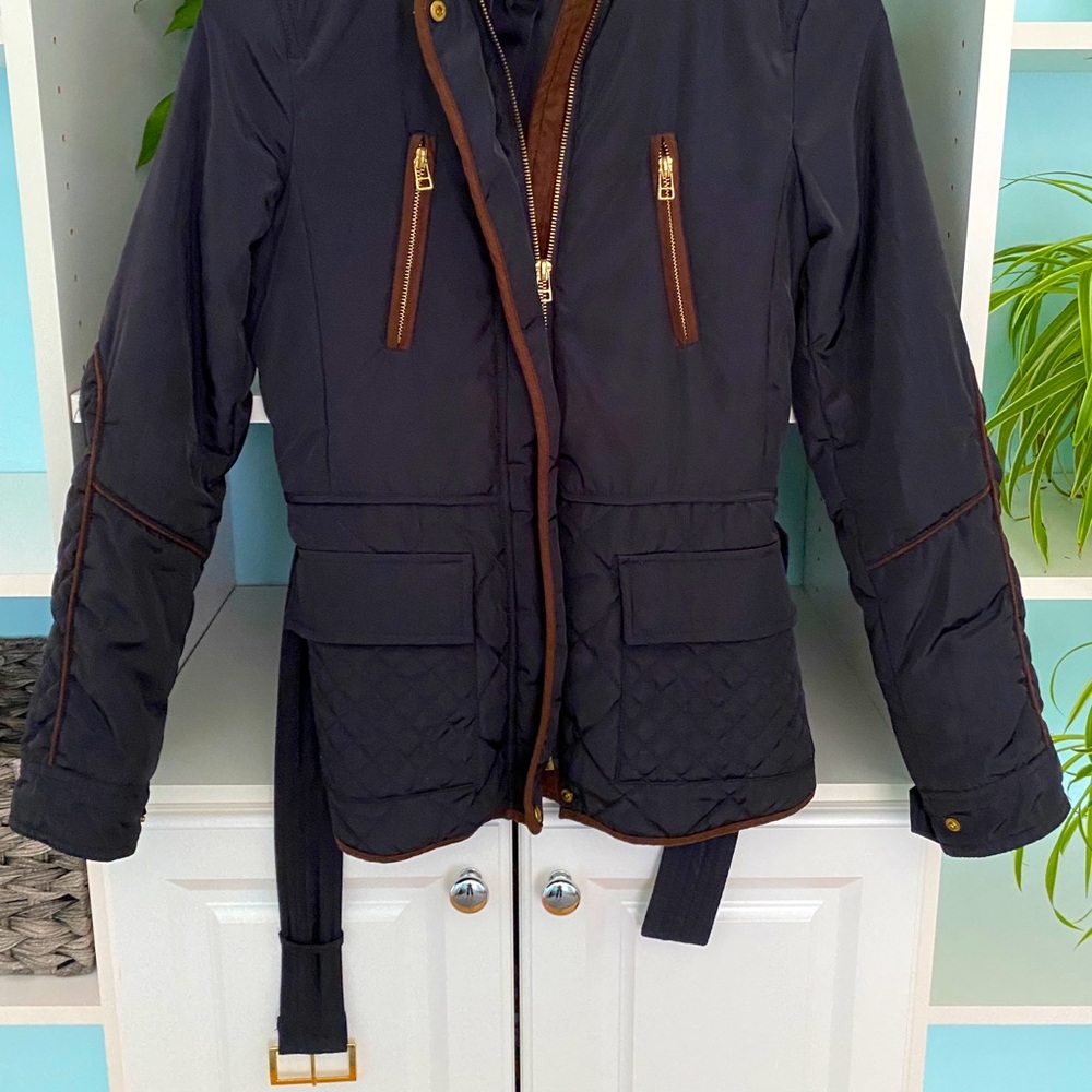 Navy blue quilted riding jacket with brown trim